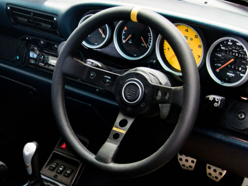 Volante momo Porsche oficial negro y amarillo